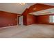 Spacious carpeted main bedroom featuring a tray ceiling, large window, and neutral walls at 5840 Harrier Ln, Atlanta, GA 30349
