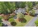 Aerial shot highlighting the home's beautiful lawn and mature tree coverage on corner lot at 899 Fairwood Nw Way, Acworth, GA 30101