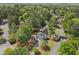 Aerial view of traditional home in a lush, wooded neighborhood on corner lot at 899 Fairwood Nw Way, Acworth, GA 30101