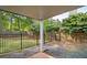 Cozy covered back patio features a concrete floor and a view of the fenced yard at 899 Fairwood Nw Way, Acworth, GA 30101
