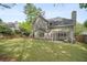 Spacious backyard, complete with a covered patio, mature trees and a well maintained lawn at 899 Fairwood Nw Way, Acworth, GA 30101