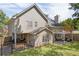Spacious backyard featuring a patio seating area and fenced space for outdoor enjoyment at 899 Fairwood Nw Way, Acworth, GA 30101