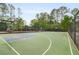 Community basketball court and playground with safety fencing at 899 Fairwood Nw Way, Acworth, GA 30101