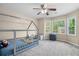 Bright bedroom features a stylish canopy bed, plush carpet, ceiling fan and natural light at 899 Fairwood Nw Way, Acworth, GA 30101