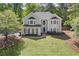 Traditional two-story home boasts a meticulously maintained lawn and inviting curb appeal at 899 Fairwood Nw Way, Acworth, GA 30101