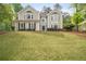 Inviting two-story home boasts a well-manicured lawn and classic architectural details at 899 Fairwood Nw Way, Acworth, GA 30101