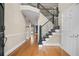 Welcoming foyer features hardwood floors, staircase with decorative iron railings and natural light at 899 Fairwood Nw Way, Acworth, GA 30101