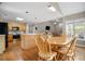 Open concept kitchen and dining area with wood cabinets, hardwood floors, and abundant natural light at 899 Fairwood Nw Way, Acworth, GA 30101