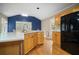 Kitchen featuring hardwood floors, wood cabinets, stainless steel appliances, and a breakfast bar at 899 Fairwood Nw Way, Acworth, GA 30101