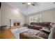 Spacious living room with a fireplace, vaulted ceilings, hardwood floors, and a comfortable sectional sofa at 899 Fairwood Nw Way, Acworth, GA 30101