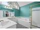 Bright main bathroom showcasing a soaking tub and glass enclosed shower at 899 Fairwood Nw Way, Acworth, GA 30101