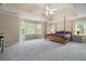 Spacious main bedroom boasting a tray ceiling and abundant natural light at 899 Fairwood Nw Way, Acworth, GA 30101