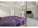 Main bedroom featuring soft carpet, ceiling fan, and access to multiple rooms at 899 Fairwood Nw Way, Acworth, GA 30101