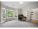 Inviting home office featuring a large bay window, carpeting, and neutral paint at 899 Fairwood Nw Way, Acworth, GA 30101