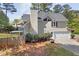 Backyard featuring a tall chimney, a fenced yard, and mature trees at 899 Fairwood Nw Way, Acworth, GA 30101