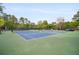 Tennis courts with benches and mature trees at 899 Fairwood Nw Way, Acworth, GA 30101