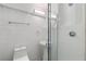 A clean, all-white bathroom featuring tile, sleek fixtures, and a glass-enclosed shower at 1121 Dawn View Nw Ln, Atlanta, GA 30327