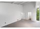 Spacious bedroom with vaulted ceilings, neutral carpet, and ensuite access at 1121 Dawn View Nw Ln, Atlanta, GA 30327