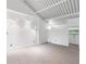 Bright and spacious bedroom with vaulted ceilings, track lighting, and a view to trees at 1121 Dawn View Nw Ln, Atlanta, GA 30327