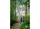 Modern home with unique architectural design, nestled in a lush wooded setting, blending nature and contemporary style at 1121 Dawn View Nw Ln, Atlanta, GA 30327