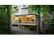 Contemporary home with large glass windows and walls offering stunning views of the surrounding trees at 1121 Dawn View Nw Ln, Atlanta, GA 30327