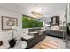 Modern kitchen with stainless steel appliances, granite countertops, and a large window with scenic views at 1121 Dawn View Nw Ln, Atlanta, GA 30327