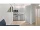 Bright kitchen featuring stainless steel appliances, gray cabinets, and a view to the living room at 1121 Dawn View Nw Ln, Atlanta, GA 30327