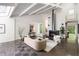 Spacious living room with high ceilings, sleek fireplace, and comfortable contemporary furnishings at 1121 Dawn View Nw Ln, Atlanta, GA 30327