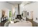 Bright living room with fireplace, modern furniture, and large windows overlooking the outdoors at 1121 Dawn View Nw Ln, Atlanta, GA 30327