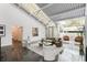 Open-concept living area with skylights, modern decor, and stylish seating arrangements at 1121 Dawn View Nw Ln, Atlanta, GA 30327