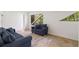 Bright living room featuring large windows with nature views and modern sofas, offering a serene and stylish space at 1121 Dawn View Nw Ln, Atlanta, GA 30327