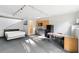 Open living space featuring a kitchen, dining area, and bed, complete with track lighting at 1121 Dawn View Nw Ln, Atlanta, GA 30327