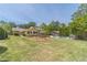 Lush backyard showcasing a swing set, a well-maintained lawn, and a pool at 1924 Windburn Ct, Snellville, GA 30078