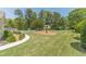 Landscaped backyard with a pool and manicured grass at 1924 Windburn Ct, Snellville, GA 30078