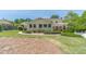 Green backyard with mature landscaping, a manicured lawn and inground pool at 1924 Windburn Ct, Snellville, GA 30078