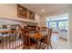 Cozy dining area with a wooden table set, overlooking the warm living space below at 1924 Windburn Ct, Snellville, GA 30078