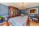Traditional dining room with hardwood floors, chandelier and wooden furniture at 1924 Windburn Ct, Snellville, GA 30078