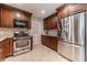 Modern kitchen with stainless steel appliances, granite countertops, and ample cabinet space at 1924 Windburn Ct, Snellville, GA 30078