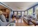 Well-lit living room with hardwood floors and access to the backyard at 1924 Windburn Ct, Snellville, GA 30078
