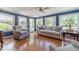 Bright living room with hardwood floors, neutral furniture and view to backyard at 1924 Windburn Ct, Snellville, GA 30078