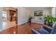 Cozy living room showcasing hardwood floors, bright kitchen access, and comfortable seating at 1924 Windburn Ct, Snellville, GA 30078