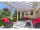 Comfortable backyard patio with outdoor seating beneath a pergola at 1924 Windburn Ct, Snellville, GA 30078