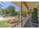 Relaxing porch view featuring manicured landscaping and elegant architectural columns at 1924 Windburn Ct, Snellville, GA 30078