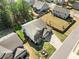Aerial view of a home with a manicured lawn, fenced backyard, and neighborhood surroundings at 3875 Grandview Manor Dr, Cumming, GA 30028
