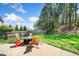 Large patio with modern outdoor furniture, perfect for entertaining in the beautifully landscaped backyard at 3875 Grandview Manor Dr, Cumming, GA 30028