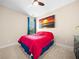 Cozy bedroom with neutral carpet, a ceiling fan, and a bright window with blue curtains at 3875 Grandview Manor Dr, Cumming, GA 30028