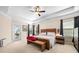 Bright, spacious bedroom with full sized bed, tray ceiling, and exterior door at 3875 Grandview Manor Dr, Cumming, GA 30028