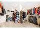 Spacious walk-in closet with ample shelving and hanging space for clothes and accessories at 3875 Grandview Manor Dr, Cumming, GA 30028
