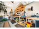 Well-organized garage with shelving, workbenches, and storage for tools and equipment at 3875 Grandview Manor Dr, Cumming, GA 30028