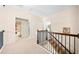Light and airy hallway with staircase, neutral walls, and carpeted flooring at 3875 Grandview Manor Dr, Cumming, GA 30028